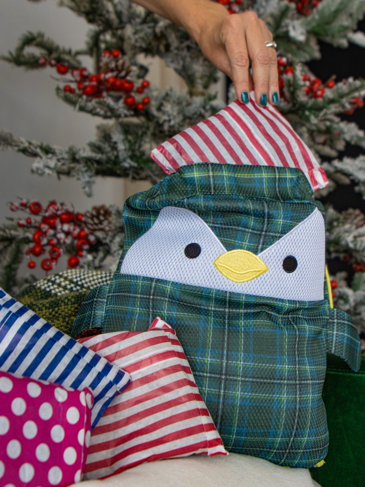 Pulling one striped mystery parcel out of Scotch the penguin washbag