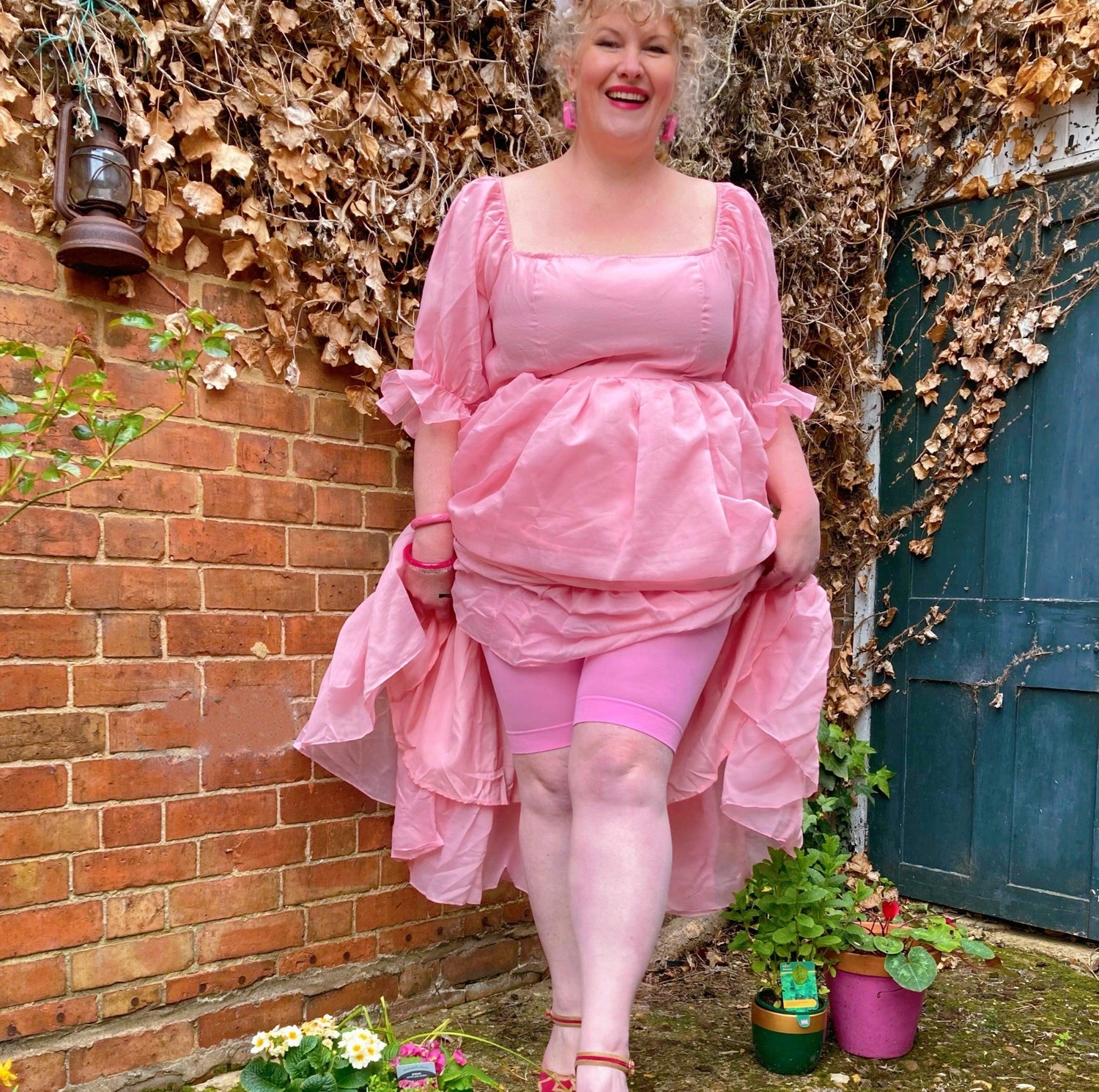 Woman wearing dragon fruit chub rub shorts