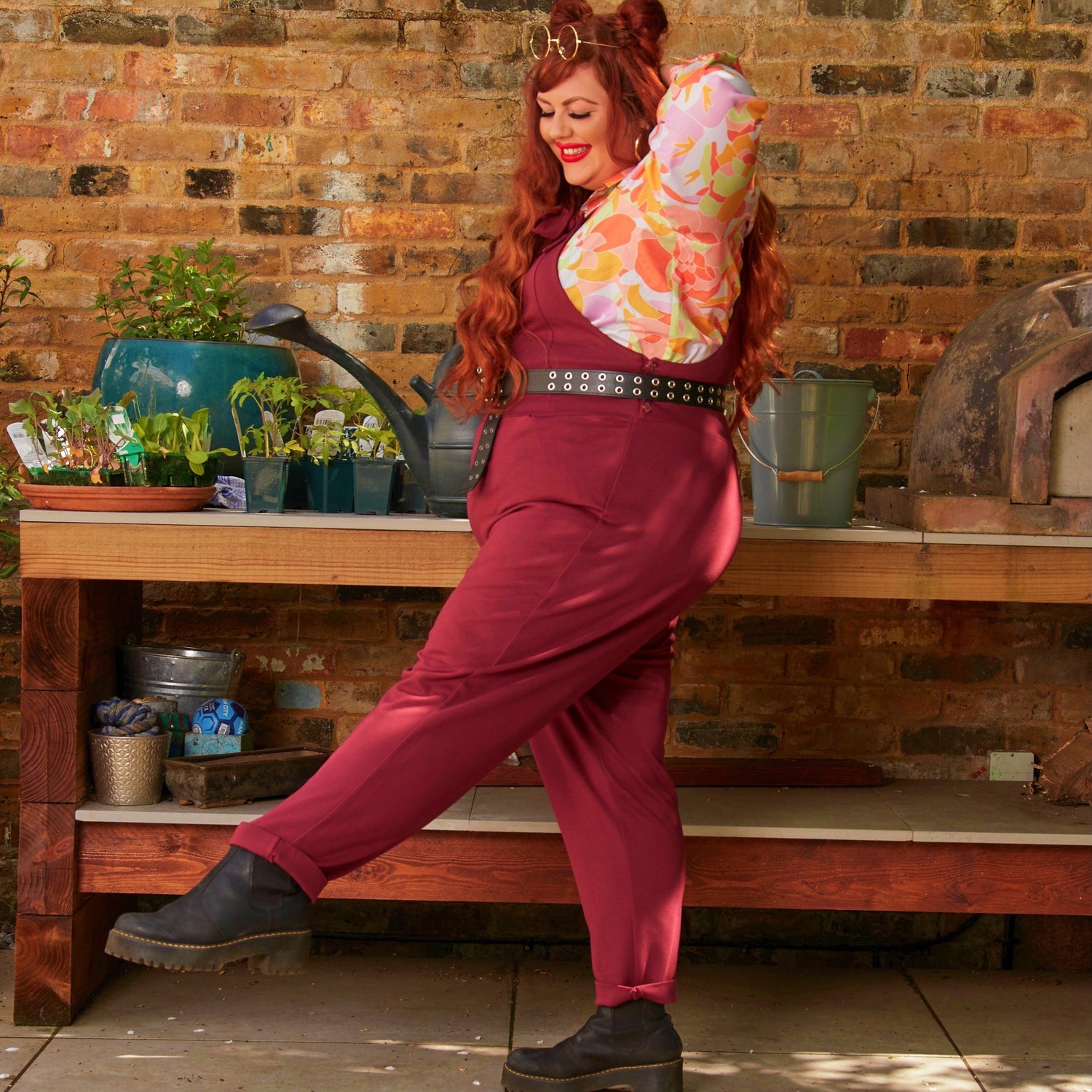 Woman wearing burgundy dungarees