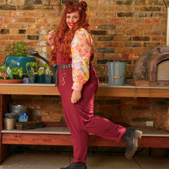 Woman wearing burgundy dungarees